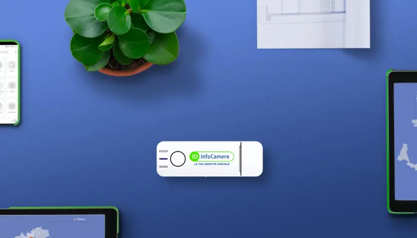Chiavetta USB InfoCamere, la tua identità digitale, con smartphone e tablet che mostrano mappe e servizi. Un foglio pra digitale per la tua identità.