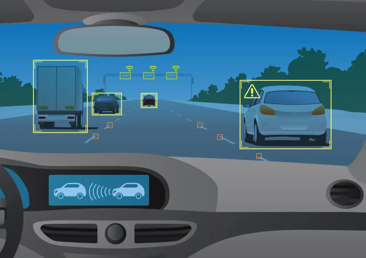 Vista dall'interno di un'auto con sistema di guida assistita che rileva camion, auto e segnali stradali.